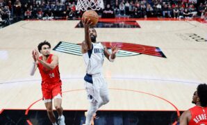 Kyrie Irving injures foot, Mavericks beat Trail Blazers behind Luka Doncic