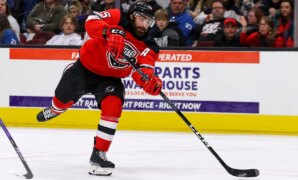 AHL hockey player scores goal after being hit in mouth by puck