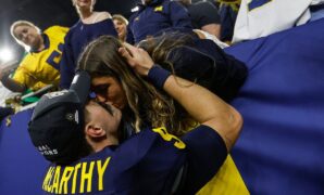 Michigan’s JJ McCarthy shares smooch with girlfriend after winning national championship