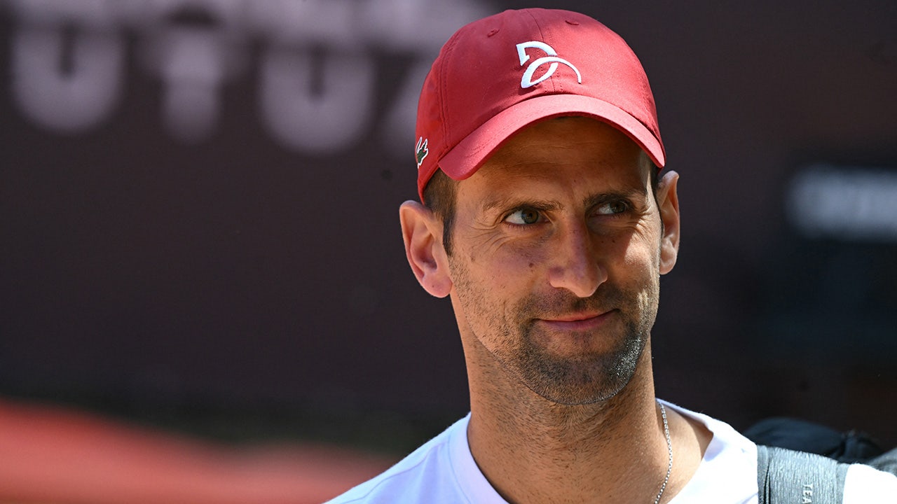 Novak Djokovic wears bicycle helmet to Italian Open training session after getting hit in the head with bottle