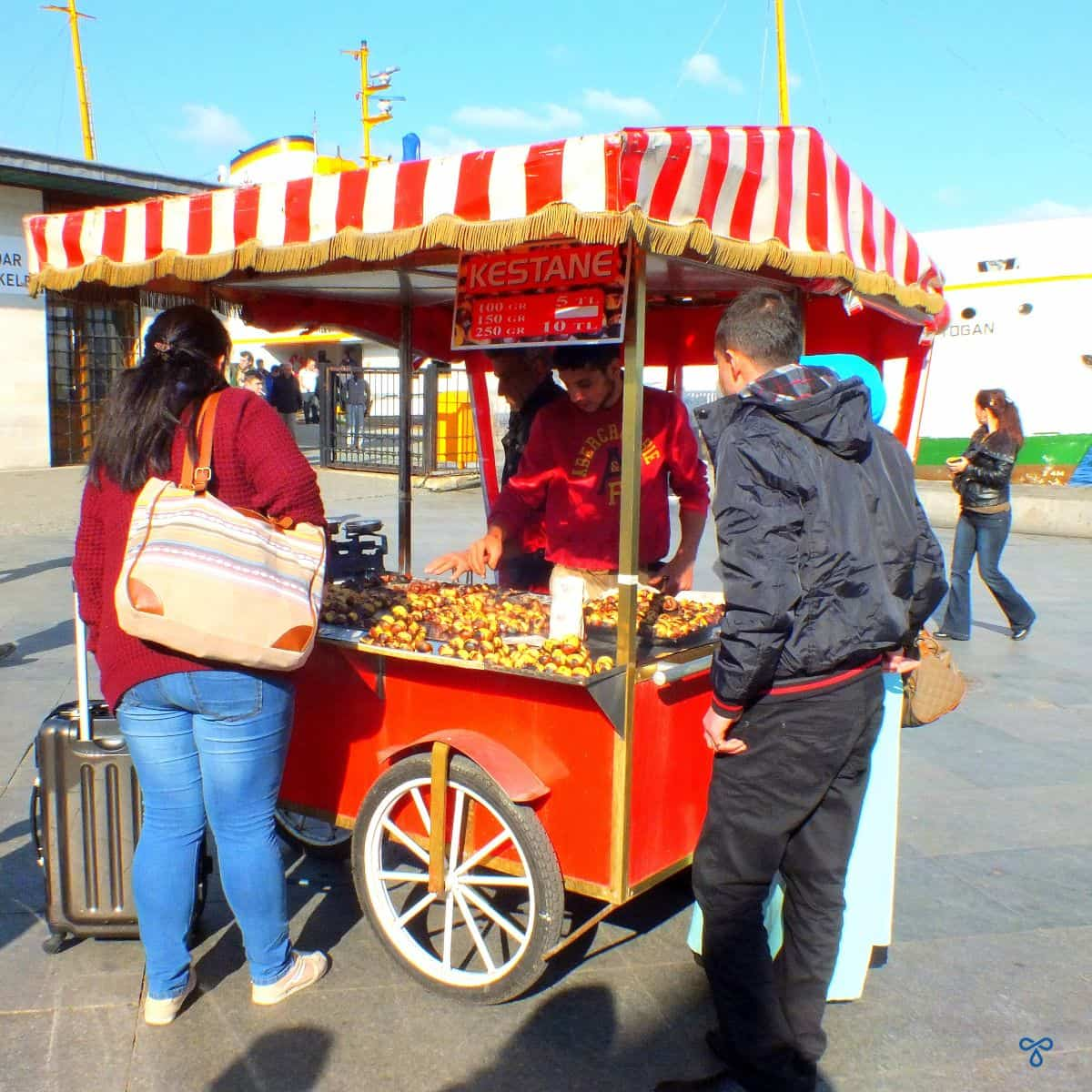 A red cart selling chestnuts in Istanbul.