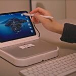 Someone combined the ipad mini and the mac studio into a desktop dock and its perfect