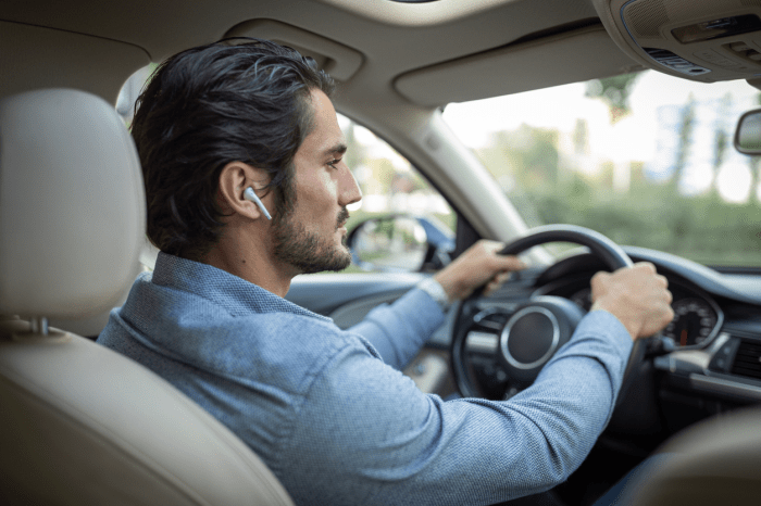 Distracted driving listening music while car driver radio changing consultation get