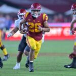 USC football team win against top-ranked rivals details