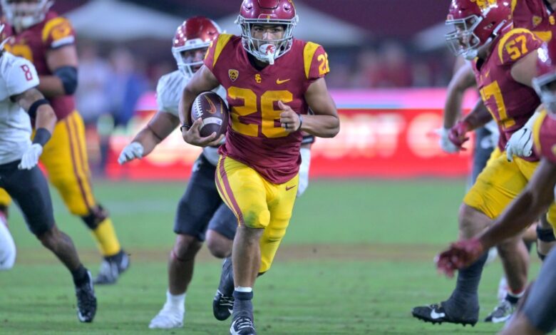 USC football team win against top-ranked rivals details