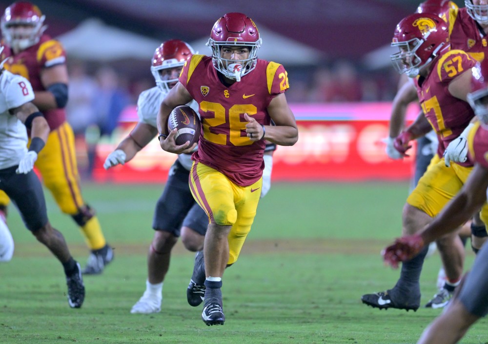 USC football team win against top-ranked rivals details